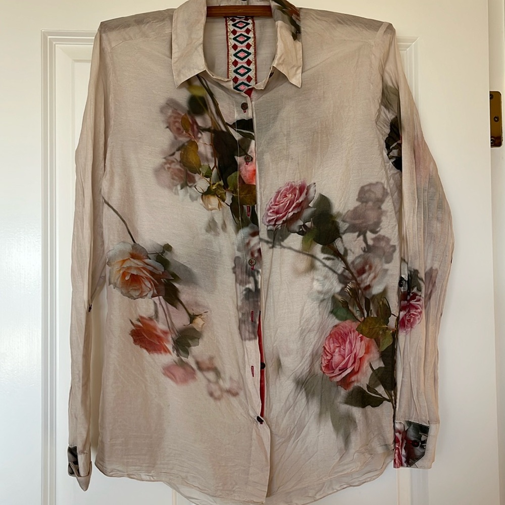 Button down blouse with shades of pink, rose, apricot roses and green leaves.